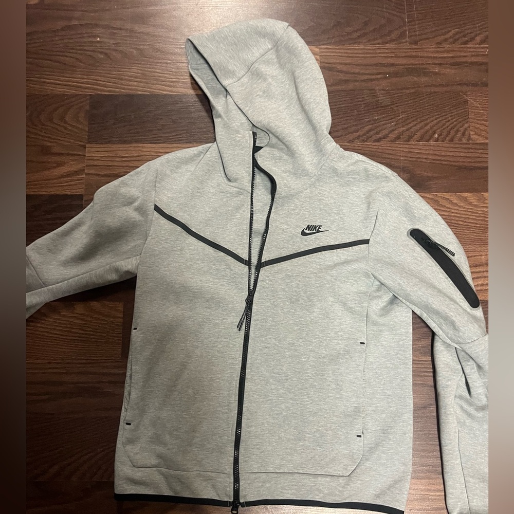 Nike tech zip up. Small stain on back. May come out